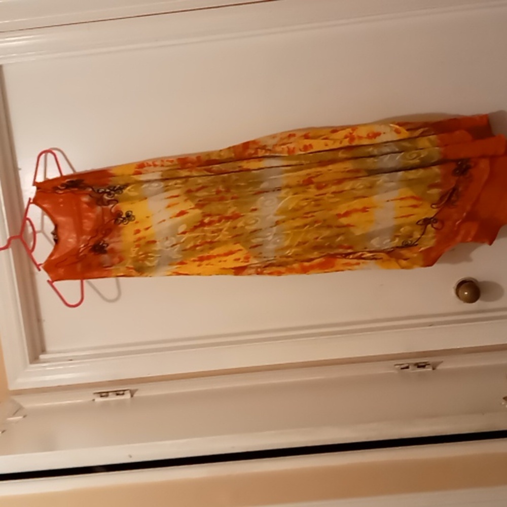 Women's sleeveless black, orange and yellow designs